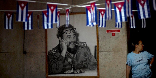 A photograph Fidel Castro hangs in a municipal building where miniature Cuban flags decorate the entrance in Havana, Cuba, Fr