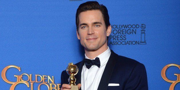 Actor Matt Bomer holds the award for Best Supporting Actor - Series, Mini-Series, TV Movie for his role in 'The Normal Heart', in the press room at the 72nd annual Golden Globe Awards, January 11, 2015 at the Beverly Hilton Hotel in Beverly Hills, California. AFP PHOTO / FREDERIC J BROWN (Photo credit should read FREDERIC J. BROWN/AFP/Getty Images)