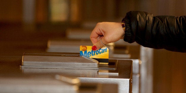 NEW YORK, UNITED STATES - JANUARY 13: A person swipes a metrocard in New York subway station on January 13, 2014 in New York, United States. The Metropolitan Transportation Authority (MTA) declares that MetroCard the subway rapid transit system is going to change until 2019. (Photo by Bilgin S. Sasmaz/Anadolu Agency/Getty Images)