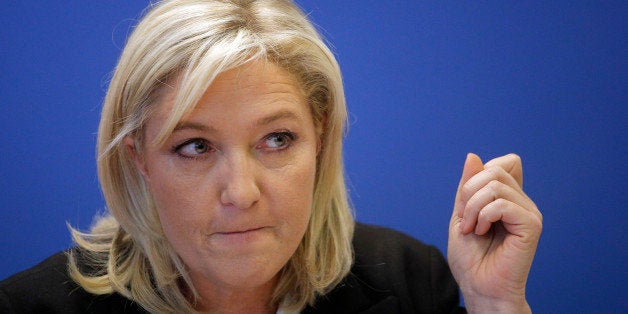 French far-right Front National leader Marine Le Pen delivers her speech during a press conference in Nanterre, outside Paris, about the recent shootings in France, Friday Jan. 16, 2015. The country is tense since 20 people, including three gunmen, were killed in last weekâs rampage. It began at the offices of satirical newspaper Charlie Hebdo. Charlie Hebdo had been repeatedly threatened for caricatures of the Muslim prophet Muhammad. (AP Photo/Christophe Ena)