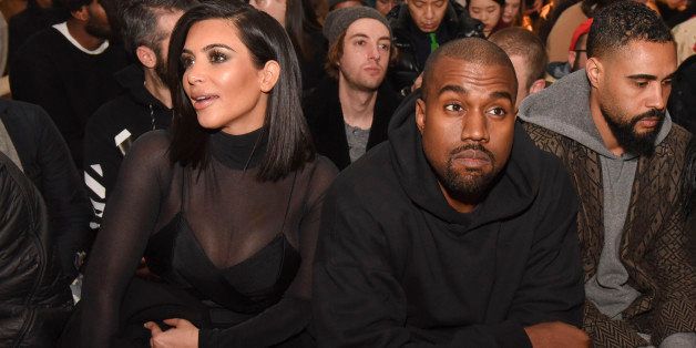 NEW YORK, NY - FEBRUARY 14: Kim Kardashian and Kanye West attend the Robert Geller show during Mercedes-Benz Fashion Week Fall 2015 at Pier 59 on February 14, 2015 in New York City. (Photo by Vivien Killilea/Getty Images)