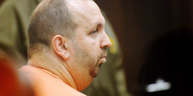 DURHAM, NC - FEBRUARY 11: Craig Stephen Hicks, 46, sits in the Durham County courtroom for his first appearance in the shooting deaths of three University of North Carolina students on February 11, 2015 in Durham, North Carolina. Hicks has been charged with three counts of first degree murder and is being held without bond. (Photo by Sara D. Davis/Getty Images)