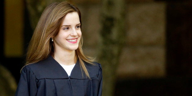 Actress Emma Watson walks between buildings following commencement services on the campus of Brown University, Sunday, May 25, 2014, in Providence, R.I. The actress, best known for her role as Hermione Granger in the âHarry Potterâ movies, graduated with a bachelor's degree in English literature from the Ivy League university. (AP Photo/Steven Senne)