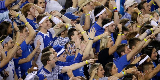 Kentucky fans cheer during the first half of the NCAA Final Four tournament college basketball championship game against Connecticut Monday, April 7, 2014, in Arlington, Texas. (AP Photo/Tony Gutierrez)