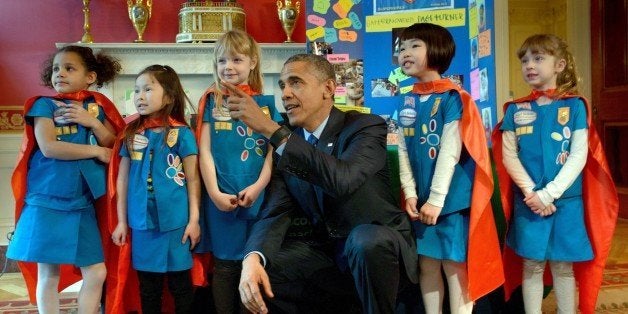 US President Barack Obama poses with girl scouts from Tulsa, Oklahoma during the 2015 White House Science Fair March 23, 2015