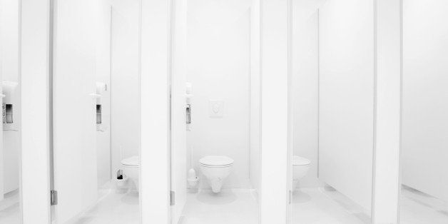 a clean new public toilet room empty