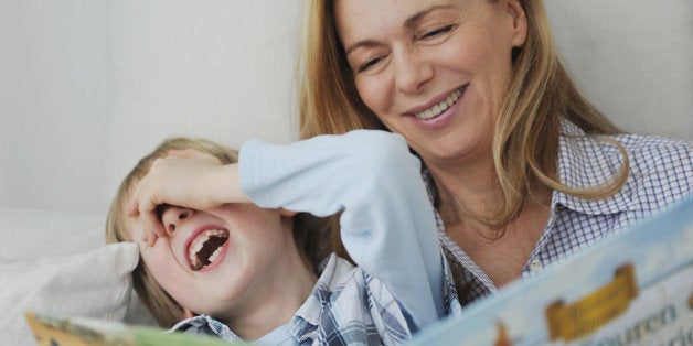 Mother and son reading a book together