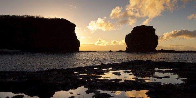 Hawaii, Lanai, Manele Bay, Sunset over Hulopoe Bay and Puu Pehe or 'Sweetheart Rock'.