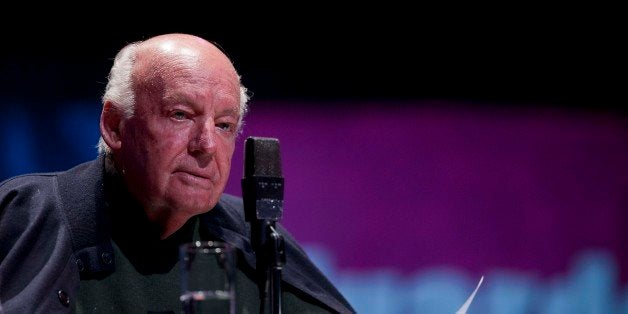 Journalist and Writer Eduardo Galeano reads a passage from one of his books during an event organized by the the National Autonomous University of Mexico, U.N.A.M., in Mexico City, Monday Nov. 5, 2012. (AP Photo/Eduardo Verdugo)