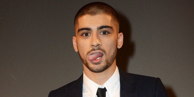 LONDON, ENGLAND - APRIL 17: SUN NEWSPAPER OUT. MANDATORY CREDIT PHOTO BY DAVE J. HOGAN GETTY IMAGES REQUIRED Zayn Malik acc