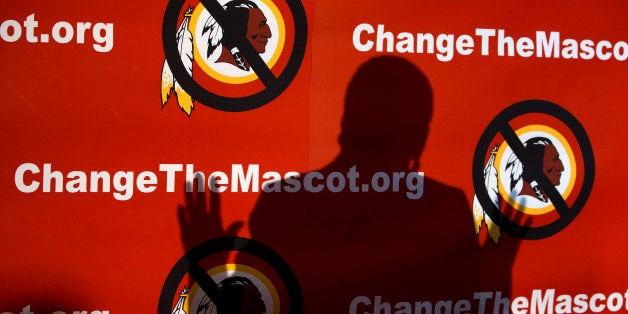 The shadow of Del. Eleanor Holmes Norton, D-D.C., is cast on the backdrop during the Oneida Indian Nation's Change the Mascot symposium, Monday, Oct. 7, 2013, in Washington, calling for the Washington Redskins NFL football team to change its name. During an interview, President Barack Obama suggested that the owner of the Washington Redskins football team consider changing its name because, the president said, the current name offends "a sizable group of people." (AP Photo/Carolyn Kaster)