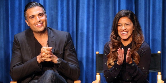 BEVERLY HILLS, CA - SEPTEMBER 06: Actor Jaime Camil (L) and actress Gina Rodriguez speak during The Paley Center for Media's PaleyFest 2014 Fall TV Previews - The CW, at The Paley Center for Media on September 6, 2014 in Beverly Hills, California. (Photo by Frederick M. Brown/Getty Images)