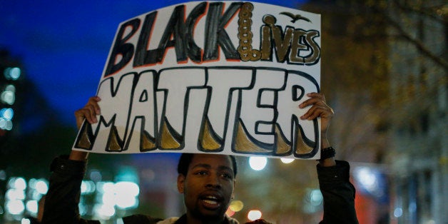 NEW YORK, NY - APRIL 29: A man takes part in a Solidarity With City Of Baltimore rally at Union Square on April 29, 2015 in New York City. in Baltimore, Maryland remains on edge in the wake of the death of Freddie Gray, though the city has been largely peaceful following a day of rioting this past Monday. Gray, 25, was arrested for possessing a switch blade knife April 12 outside the Gilmor Houses housing project on Baltimore's west side. According to his attorney, Gray died a week later in the hospital from a severe spinal cord injury he received while in police custody. . (Photo by Kena Betancur/Getty Images)