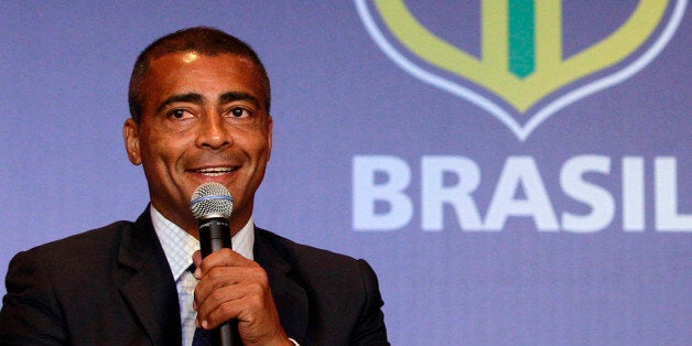 FILE - In this Dec. 23, 2011 file photo, former soccer star Romario speaks at a news conference in Rio de Janeiro, Brazil. Brazilian congressman and former football great Romario has launched another attack against FIFA, calling president Sepp Blatter "a thief" and secretary general Jerome Valcke "a blackmailer." The comments came at a congressional hearing promoted by a tourism and sports commission on Tuesday, Oct. 15, 2013. (AP Photo/Victor R. Caivano, File)