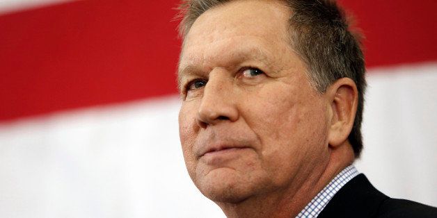 FILE-This Saturday, April 18, 2015 file photo shows Gov. John Kasich, R-Ohio, speaking at the Republican Leadership Summit in Nashua, N.H. The Ohio House was slated to vote Wednesday, APRIL 22, 2015 on the stateâs two-year, $71.5 billion budget after the GOP majority pulled many of the governorâs tax policies, added more money for schools and revised certain health-care-related initiatives. The proposal contains a smaller state income tax cut than what Gov. Kasich had pitched in his spending blueprint, which funds state operations for the two years beginning July 1. House passage on Wednesday would send the bill to the Senate. (AP Photo/Jim Cole, File)