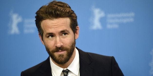 Canadian actor Ryan Reynolds poses for photographers during a photocall for the film 'Woman in Gold' presented as Berlinale Special at the 65th Berlin International Film Festival Berlinale in Berlin, on February 9, 2015. AFP PHOTO / ODD ANDERSEN (Photo credit should read ODD ANDERSEN/AFP/Getty Images)