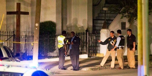 Police stand outside the Emanuel AME Church following a shooting Wednesday, June 17, 2015, in Charleston, S.C. (AP Photo/Davi