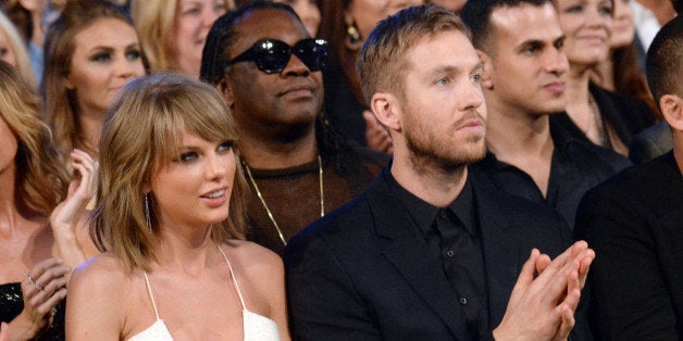 LAS VEGAS, NV - MAY 17: Singer Taylor Swift (L) and DJ Calvin Harris attend the 2015 Billboard Music Awards at MGM Grand Gar
