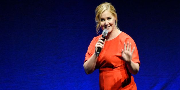 Amy Schumer, the writer and star of the upcoming film "Trainwreck," waves to the audience during the Universal Pictures presentation at CinemaCon 2015 at Caesars Palace on Thursday, April 23, 2015, in Las Vegas. (Photo by Chris Pizzello/Invision/AP)