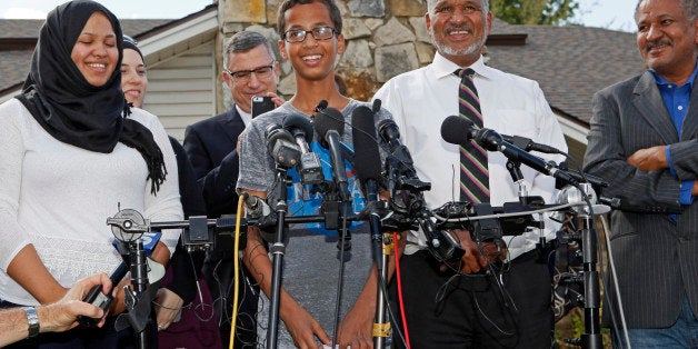 IRVING, TX - SEPTEMBER 16: 14-year-old Ahmed Ahmed Mohamed, surrounded by his family, speaks during a news conference on September 16, 2015 in Irving, Texas. Mohammed was detained after a high school teacher falsely concluded that a homemade clock he brought to class might be a bomb. The news converence, held outside the Mohammed family home, was hosted by the North Texas Chapter of the Council on American-Islamic Relations. (Photo by Ben Torres/Getty Images)