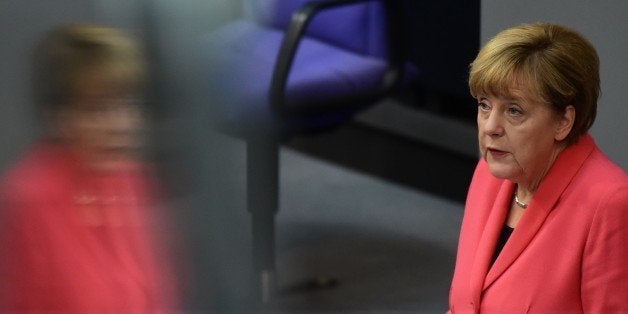 German Chancellor Angela Merkel addresses the Bundestag, the lower house of parliament in Berlin on September 24, 2015. Merkel said that a European Union deal to relocate 120,000 refugees was far from what was necessary to resolve the biggest migrant crisis facing the region since World War II. AFP PHOTO / JOHN MACDOUGALL (Photo credit should read JOHN MACDOUGALL/AFP/Getty Images)