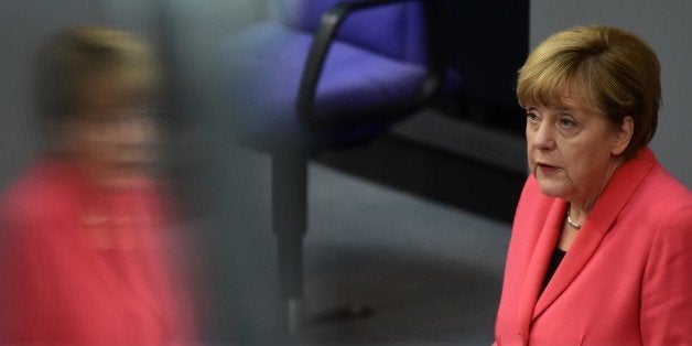 German Chancellor Angela Merkel addresses the Bundestag, the lower house of parliament in Berlin on September 24, 2015. Merkel said that a European Union deal to relocate 120,000 refugees was far from what was necessary to resolve the biggest migrant crisis facing the region since World War II. AFP PHOTO / JOHN MACDOUGALL (Photo credit should read JOHN MACDOUGALL/AFP/Getty Images)