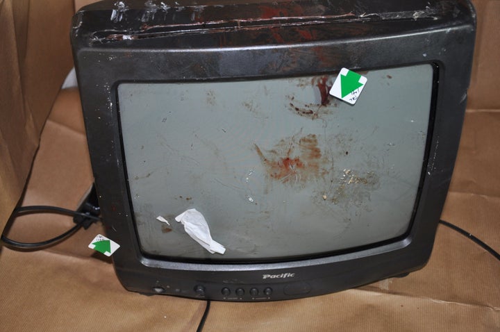 Bloodstains on the TV that was used to hit Wrightson in her home 