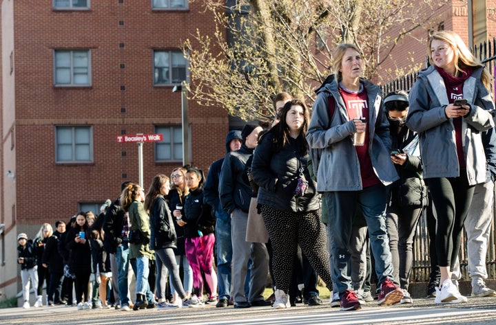 A line of mostly students waits to enter a vaccination clinic on Wednesday amid a mumps outbreak on the Temple University campus in Philadelphia.