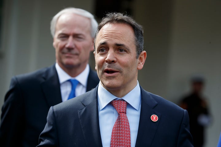 Arkansas Gov. Asa Hutchinson (R) listens at left as Kentucky Gov. Matt Bevin (R) speaks to reporters outside the White House on Feb. 27, 2017.