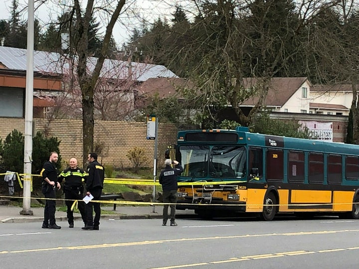  Investigators work on the scene of a shooting in Seattle on Wednesday, March 27, 2019. (AP Photo/Gene Johnson)