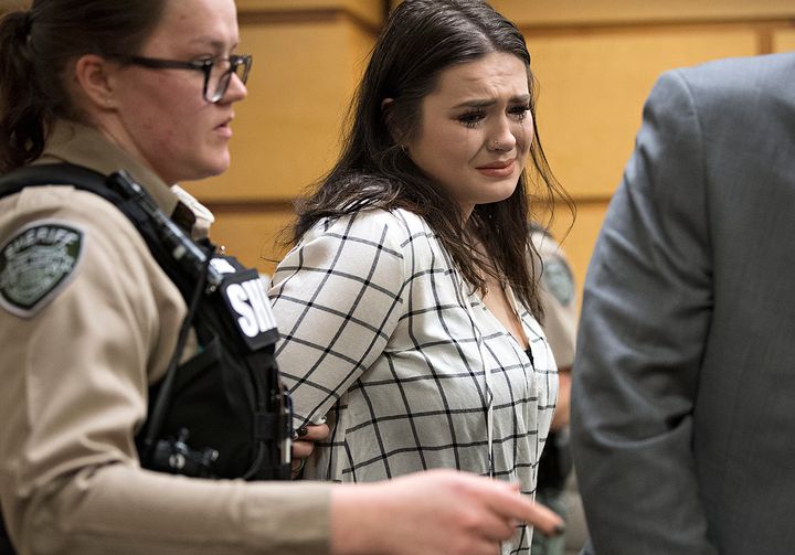 Tay'Lor Smith fights back tears as she is escorted out of the courtroom in handcuffs after being sentenced at the Clark County Courthouse in Vancouver, Wash., on Wednesday, March 27, 2019.