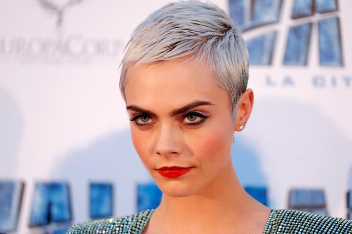 Cara Delevingne at the premiere of the film "Valerian and the City of a Thousand Planets" in Paris, July 25, 2017. She spills