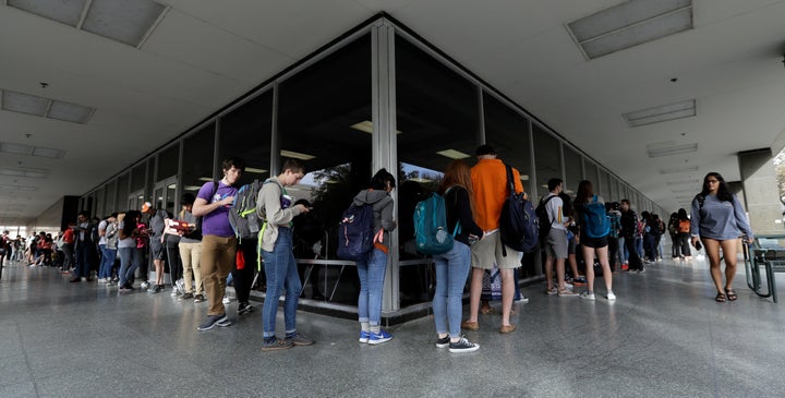 Voters, mostly students, wait to vote at a primary election polling site on the University of Texas campus in Austin, Texas,