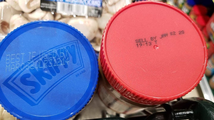 Different date labels on two brands of peanut butter. 