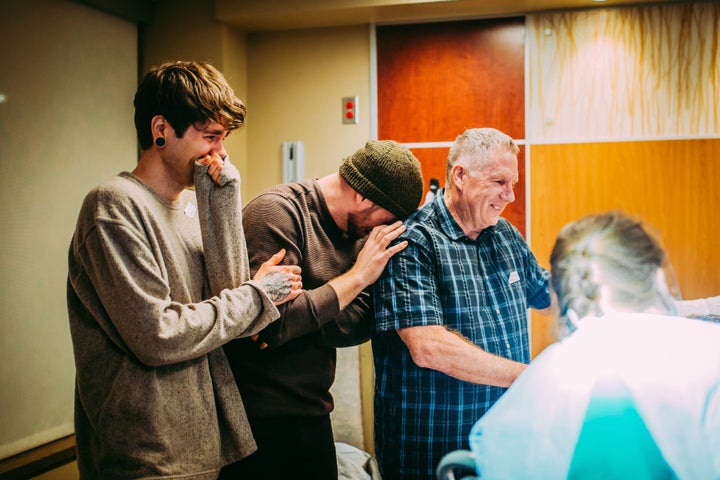 Elliot Dougherty, Matthew Eledge and Kirk Eledge share an emotional moment during Uma's delivery.