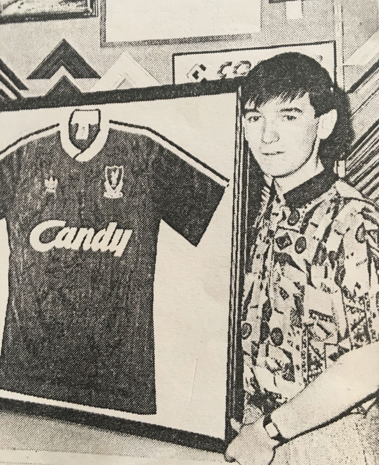Mark Aspden with a framed Liverpool shirt.