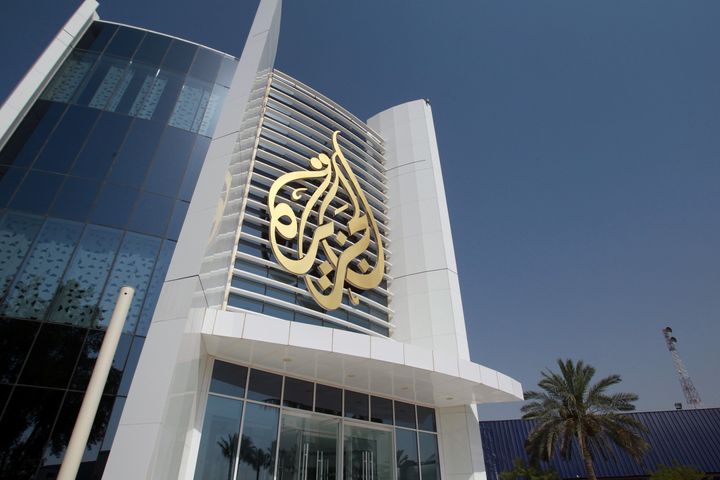 The Al Jazeera Media Network logo is seen on its headquarters building in Doha, Qatar, June 8, 2017. (REUTERS/Naseem Zeitoon)