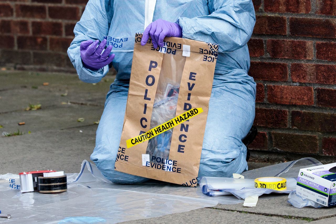 Forensics teams work at the scene of a non-fatal stabbing in Edmonton on March 31, 2019