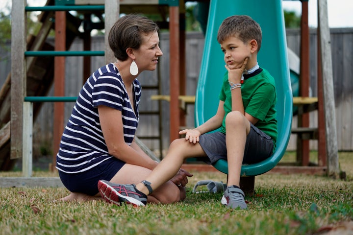 Rachel Scott, left, talks with her son, Braden, in Tomball, Texas on Friday, March 29. Braden has recovered somewhat after in