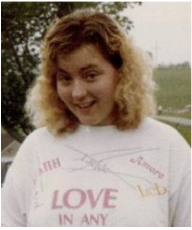 My shirt says "Love In Any Language," the title of a Sandy Patti song that all Christian high schools were required by law to insert into their graduation ceremonies.