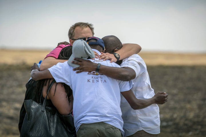 Family members and friends hug at the scene where the Ethiopian Airlines Boeing 737 Max 8 crashed shortly after takeoff on Sunday killing all 157 on board, near Bishoftu, south of Addis Ababa, in Ethiopia Wednesday, March 13, 2019.