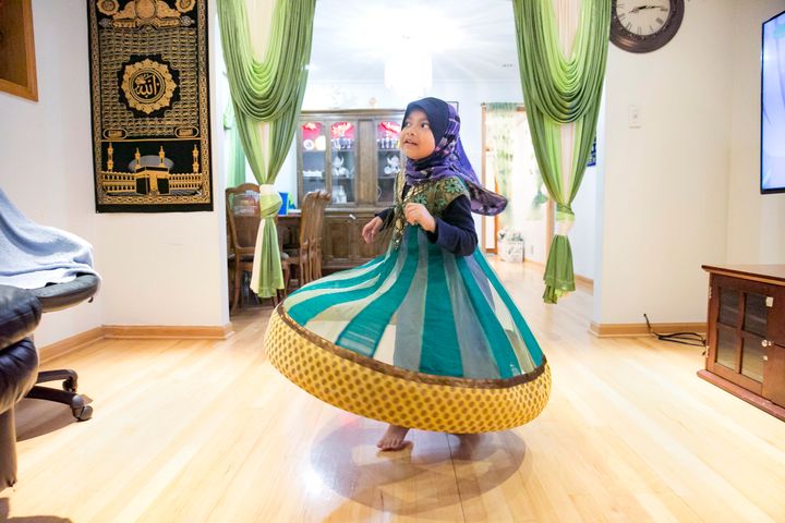 5-year-old Azrina plays in her home on January 12, 2019 in Chicago, Illinois. She is from a Rohingya refugee family who resettled in Chicago in 2014.