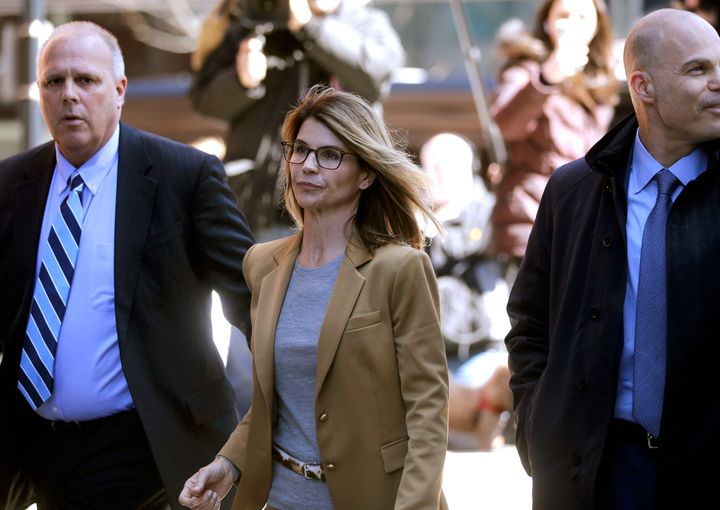 Actress Lori Loughlin, center, appeared in court on Wednesday along with some of the other parents charged in the college bribery scandal.