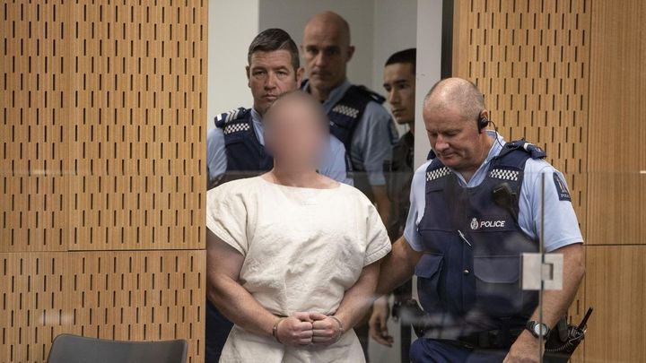 The alleged Christchurch shooter appears at a court hearing in New Zealand.