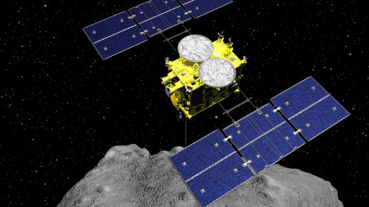 The Hayabusa2 spacecraft is shown above on the asteroid Ryugu in this computer graphics image released by the Japan Aerospace