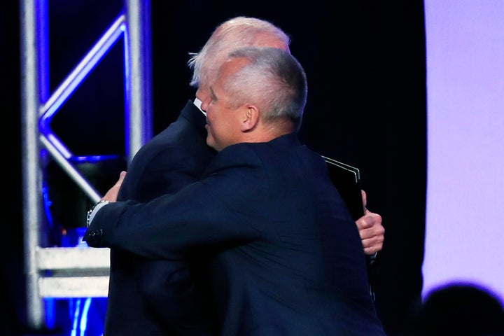 Former Vice President Joe Biden and union leader Lonnie Stephenson exchange a consensual hug.