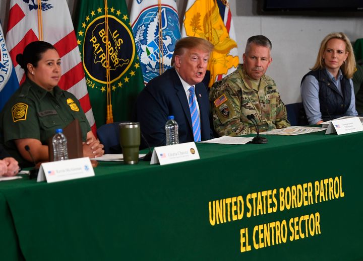 Trump speaks as Secretary of Homeland Security Kirstjen Nielsen (R) looks on during a roundtable on immigration and border security at the US Border Patrol Calexico Station in Calexico, California -- April 5, 2019. 