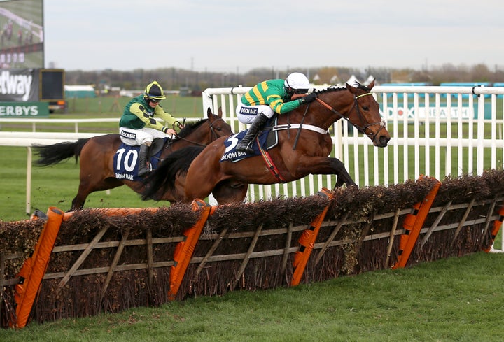 Champ ridden by jockey Mark Walsh on his way to winning the Doom Bar Sefton Novices' Hurdle during Ladies Day of the 2019 Randox Health Grand National Festival at Aintree Racecourse.