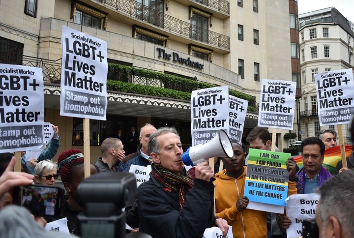 Human rights campaigner Peter Tatchell addresses crowds outside London's Dorchester Hotel on Saturday.