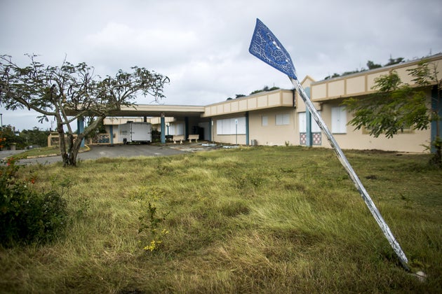A sign for handicap parking stands at a tilt outside the closed Susana Centeno Hospital on Jan.